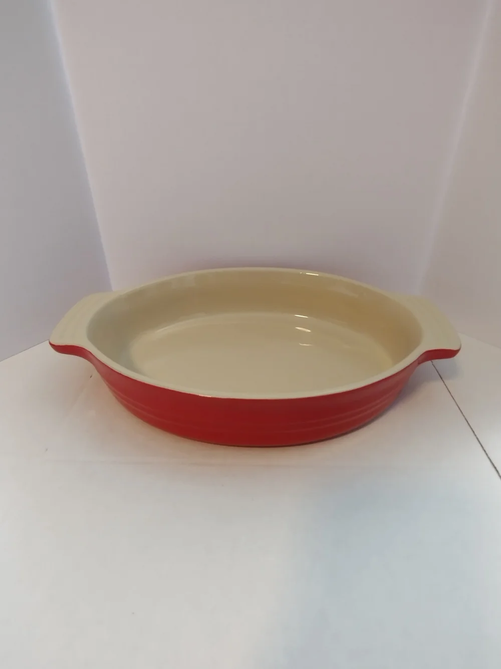 Le Creuset Red Ceramic Oval Baking Dish with Cream Interior